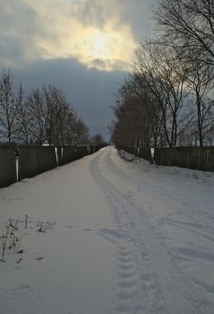 Countryside road covered with a lot of snow during winter