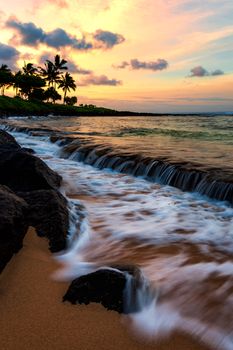 A dramatic sunset looking over the Pacific Ocean. Kauai, Hawaii.
