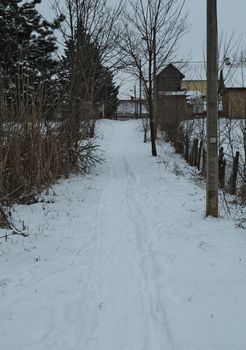 Countryside road covered with a lot of snow during winter