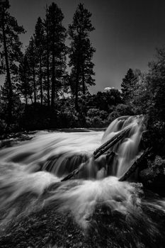 A waterfall in the mountains of central Oregon, Black and White image, day.