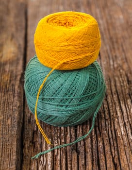 ball of thread for knitting on a wooden background