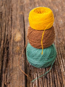 ball of thread for knitting on a wooden background