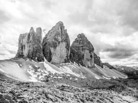 Tre Cime di Lavaredo, aka Drei Zinnen, rock formation in Dolomites, Italy. Black and white image.