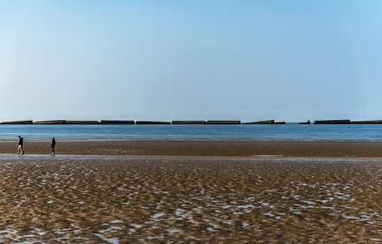 The remains of the Mulberry Harbour at Arromanches, Normandy France