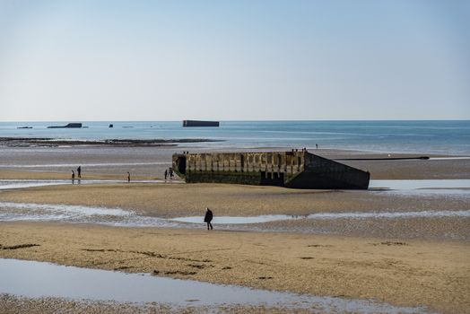 The remains of the Mulberry Harbour at Arromanches, Normandy France
