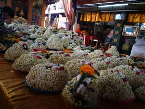 a lot of Jasmine garland flowers for play Buddha statue in Temple at the North of Thailand  at Wat Phra That Doi Kham (Temple of the Golden Mountain) Chiang Mai