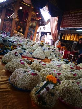 a lot of Jasmine garland flowers for play Buddha statue in Temple at the North of Thailand  at Wat Phra That Doi Kham (Temple of the Golden Mountain) Chiang Mai