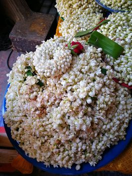 a lot of Jasmine garland flowers for play Buddha statue in Temple at the North of Thailand  at Wat Phra That Doi Kham (Temple of the Golden Mountain) Chiang Mai