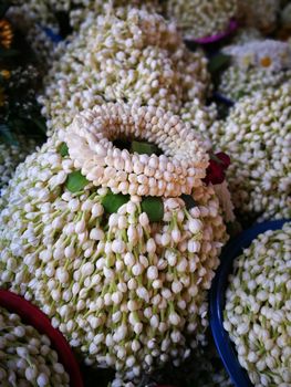 a lot of Jasmine garland flowers for play Buddha statue in Temple at the North of Thailand  at Wat Phra That Doi Kham (Temple of the Golden Mountain) Chiang Mai