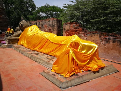 Thailand text mean Warning travelers Do not climb .The bigger Reclining Buddha in Thailand Temples at "Ayutthaya" Province that Historical Attractions.

