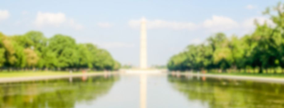 Defocused background of G. Washington Monument and Reflecting Pool, Washington DC, USA. Intentionally blurred post production for bokeh effect