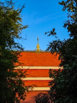 Close up of red roof of Buddhism temple in Laos.