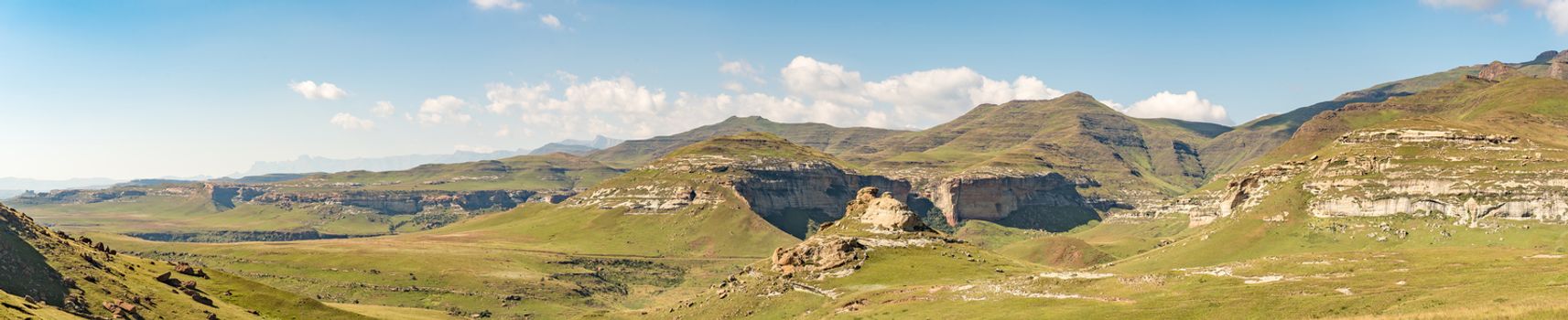 A panoramic view of the landscape at Golden Gate in the Free State Province of South Africa. The Amphitheatre in the Drakensberg is visible in the back