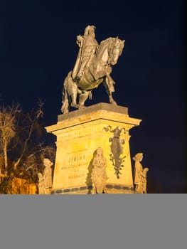 Podebrady by night. Illuminated statue of Jiri z Podebrad. Czech Republic.