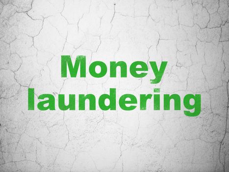 Currency concept: Green Money Laundering on textured concrete wall background