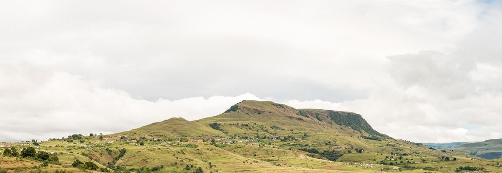 A mountain landscape with the Nkumba township between Boston and Bulwer in the Kwazulu-Natal Province of South Africa