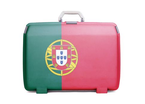 Used plastic suitcase with stains and scratches, printed with flag, Portugal