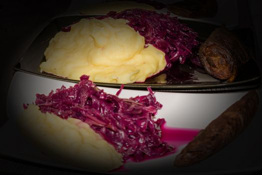 Beef roulade with red cabbage and mashed potatoes with vignette