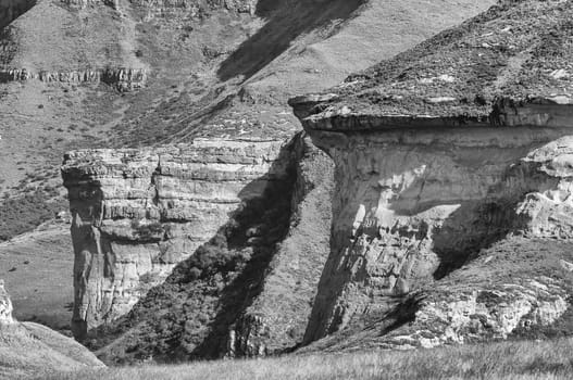 Monochrome view of the Brandwag and Mushroom Rock, two sandstone buttresses at Golden Gate in the Free State Province of South Africa