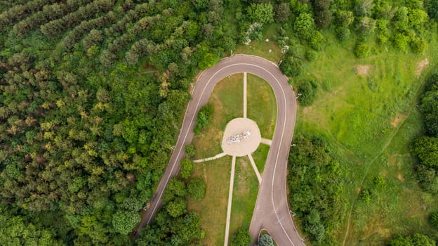walking trail in the park. shooting from a drone from a height of 150 meters. view of the road and the forest