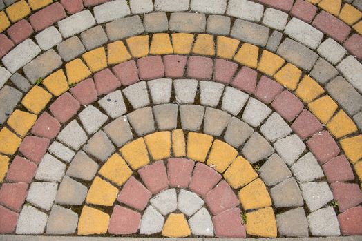 Colored tiles, masonry laid out in a semicircle. Patterned background