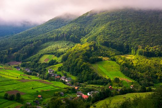 Abranka village in Carpathian mountains. lovely rural scenery on a cloudy sunrise. 