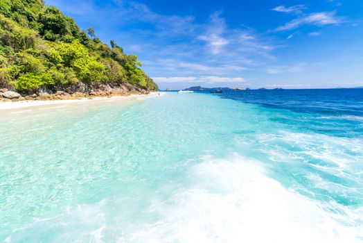 Tropical white sand beach at snoekel point from speed boat at andaman sea indian ocean Myanmar and Thailand.