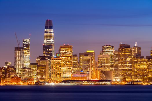 San Francisco downtown skyline at dusk from Treasure Island, California, sunset, USA.