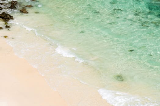 Soft wave of blue ocean on white sand beach at andaman sea, indian ocean, using as Seascape background 