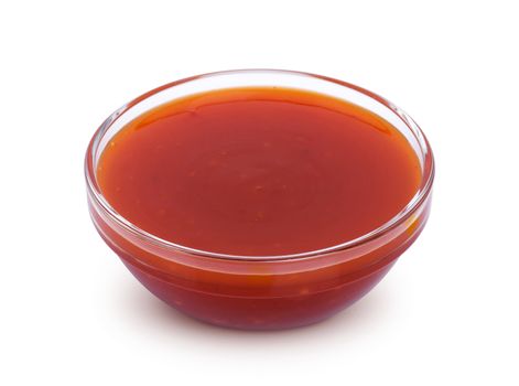 Hot chilli sauce in bowl isolated on white background with clipping path