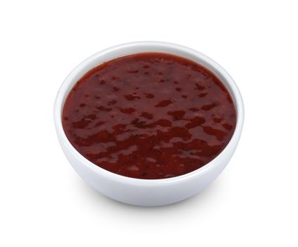 Cowberry jam in bowl isolated on white background with clipping path