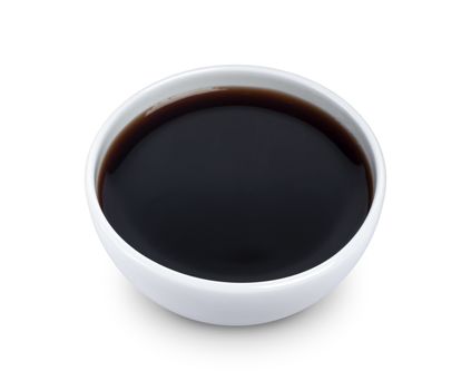 Soy sauce in bowl isolated on white background with clipping path. Top view