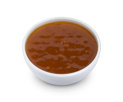 Sweet and sour sauce in bowl isolated on white background with clipping path