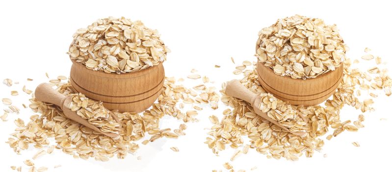 Isolated oatmeal. Oat flakes in wooden bowl on white background