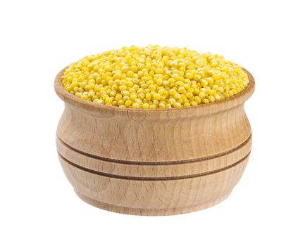 Millet in wooden bowl isolated on white background with clipping path. Close-up