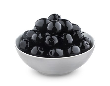 Heap of black olives in bowl isolated on white background with clipping path, close up