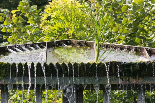 Small weir waterfall in a public park