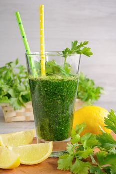 Fresh organic detox green smoothie with   parsley, celery and lemon  