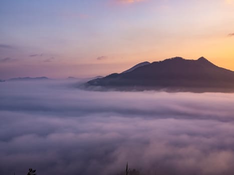 Beautiful landscape of sea of fog on Phu Thok Mountain at Chiang Khan ,Loei Province in Thailand. Sunrise in the morning.