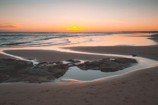 A simple sunset at Birubi beach Australia with tidal reflections
