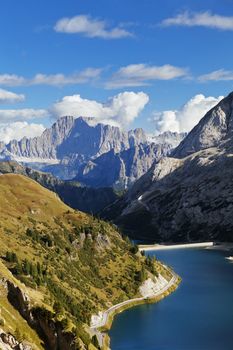 Fedaia lake in Dolomites with view of Marmolada mountain