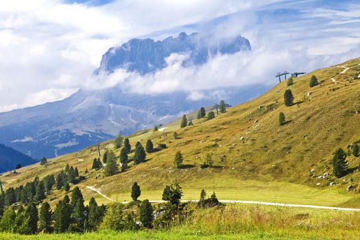Landscape with Sassolungo mountain on a sunny autumn day
