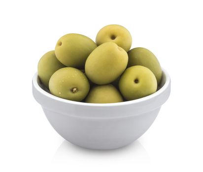 Heap of green olives in bowl isolated on white background with clipping path, close up