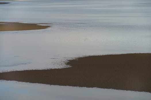 The river Minya (Minha) becomes shallow due to the low tide in the Atlantic ocean