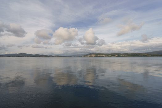 The river flows into the Atlantic Ocean here. The place where the sky converges with the earth, clouds reflect in water