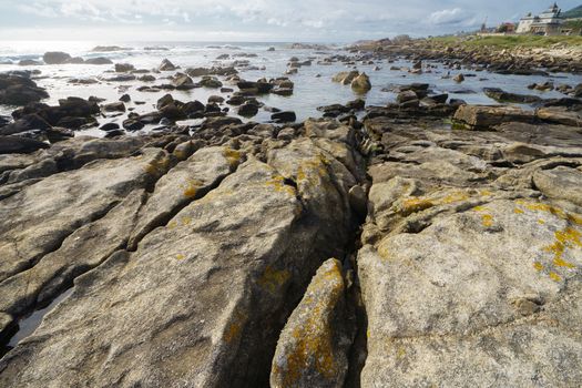 Waters of the Atlantic Ocean remained in the crevices and pits of stones after the tide