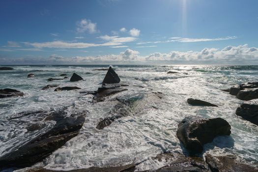 Ocean daytime landscape, giving strength. The space is filled with water, spray and ocean noise