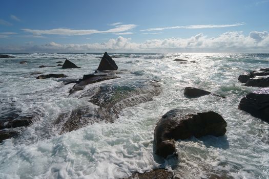 Ocean daytime landscape, giving strength. The space is filled with water, spray and ocean noise