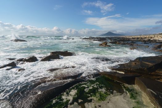 Ocean daytime landscape, giving strength. The space is filled with water, spray and ocean noise