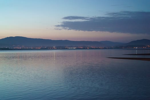 Pink calm soft sunset on the river Minaya (Minha). Nothern Portugal. Border between Portugal and Spain